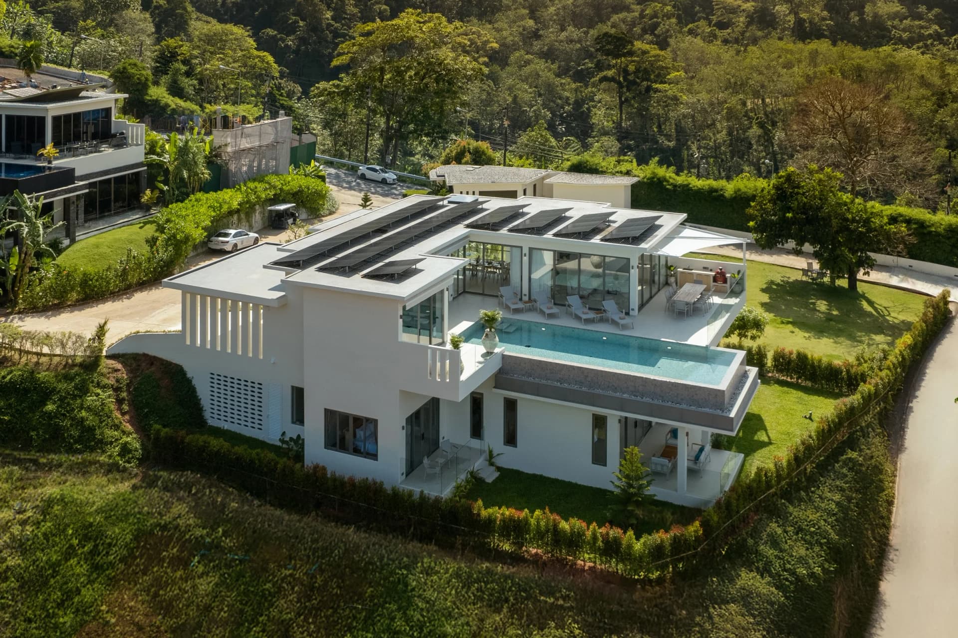 Finished villa 15 from the air: two levels, the pool deck and the hillside garden